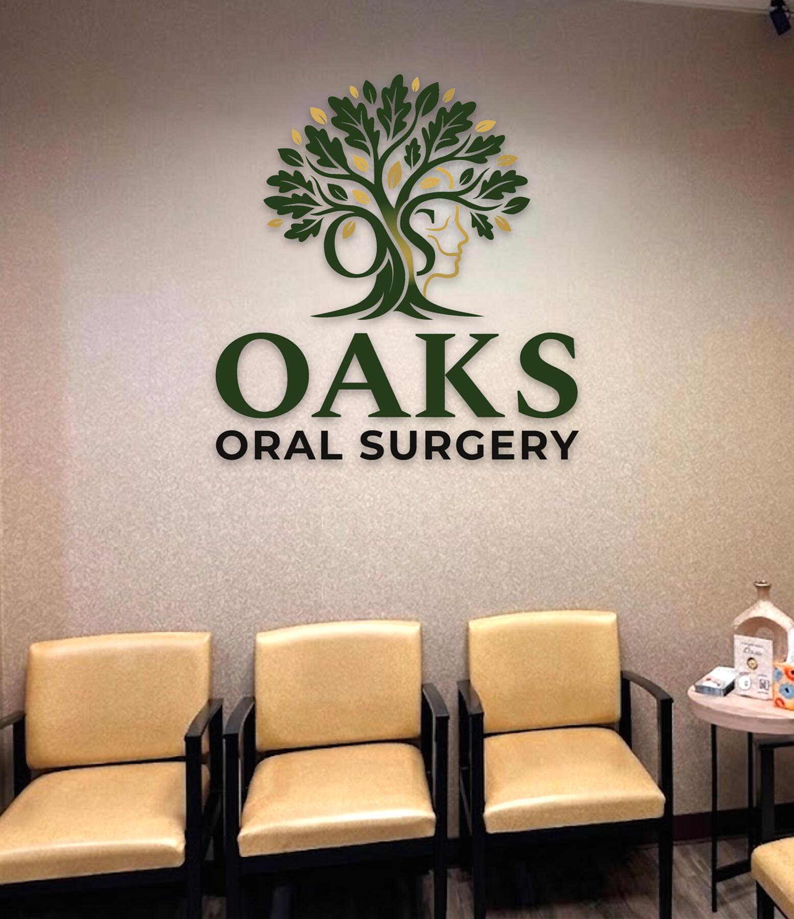 The OAKS Oral Surgery waiting room, with the practice mark on the wall above the seating